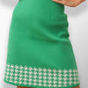 Peggi High-Waisted Midi Skirt - Front view highlighting plaid hem detail.