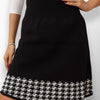 Petronella High-Waisted Midi Skirt - Close-up of plaid pattern near hem.