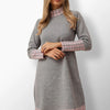 Tekla gray knit dress with pink plaid pattern.