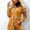 Bella mustard yellow coat with white giraffe print.