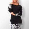Model wearing the Cintia knit dress with timeless design.