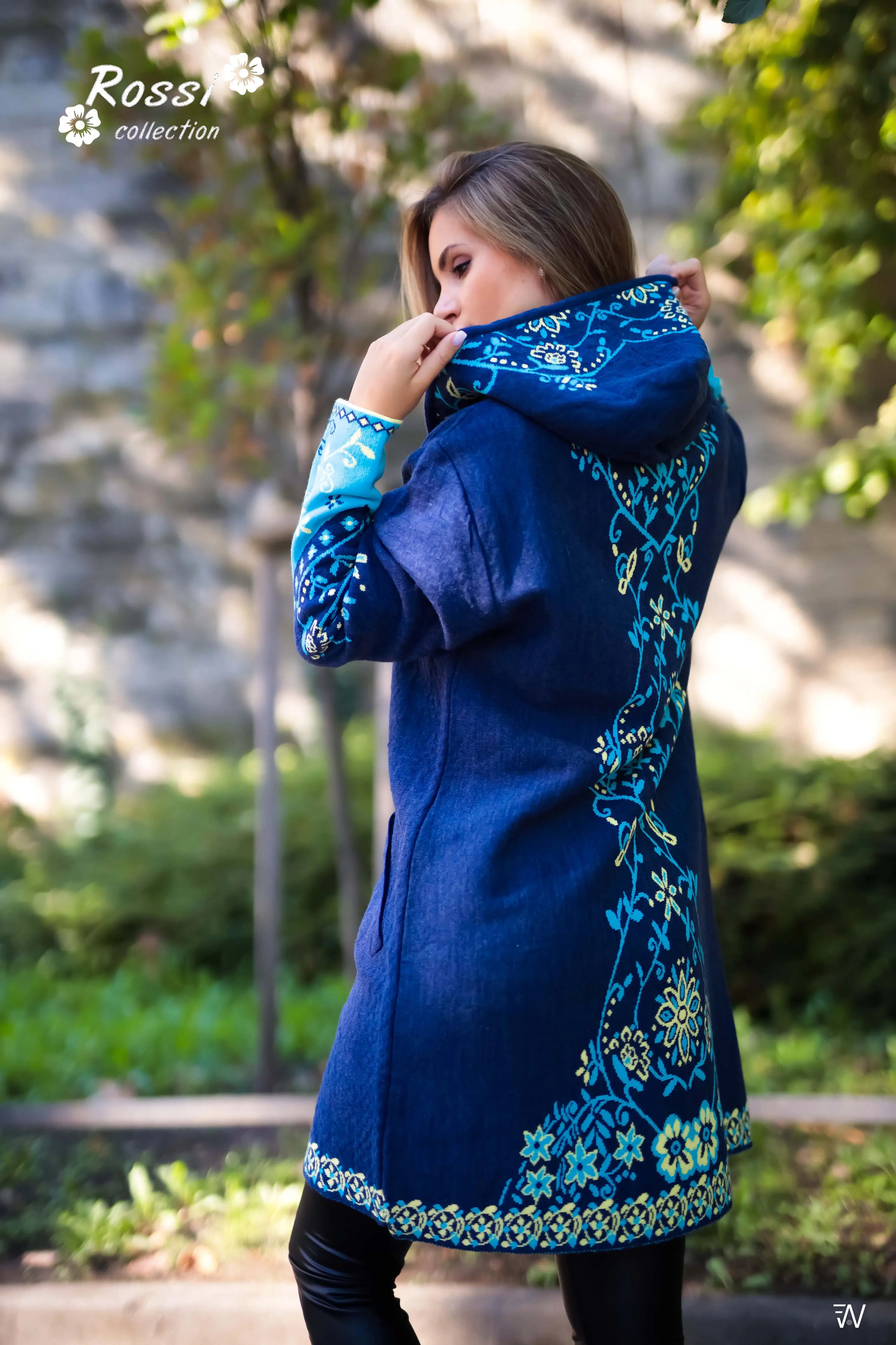 Close-up of Ivana coat’s deep pockets and floral accents.